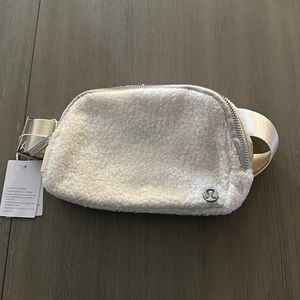 LULULEMON cream, fluffy ball bag never used